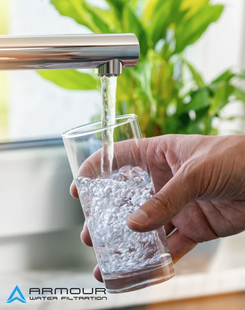 A glass of tap water is being filled for water testing Perth to assess water quality and detect contaminants in a home.